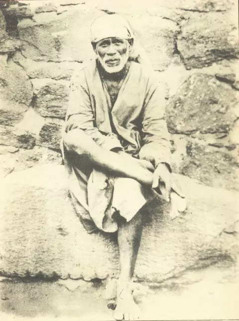 This picture shows the first picture of Sai Baba. It was used by Late Shri. B. V. Talim as a guide when he was making the sculpture.